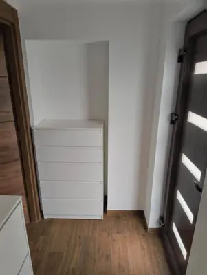 a room with a white cabinet and a door at IN Zemun Gardos Apartment in Belgrade