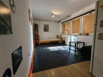 a living room with a couch and a table at Art studio Banjica in Belgrade