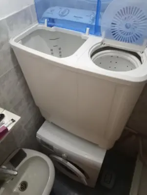 a toilet with a blue box on top of it at Art studio Banjica in Belgrade