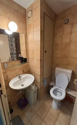 a bathroom with a toilet and a sink at Apartman Selena in Belgrade