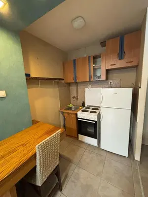 a kitchen with a white refrigerator and a stove at Apartman Selena in Belgrade