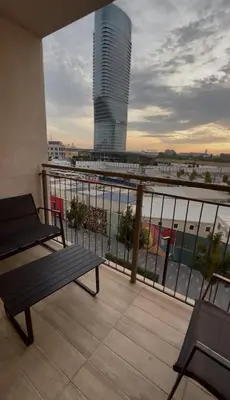 a balcony with a bench and a view of a city at BW Maca - Arcadia in Belgrade