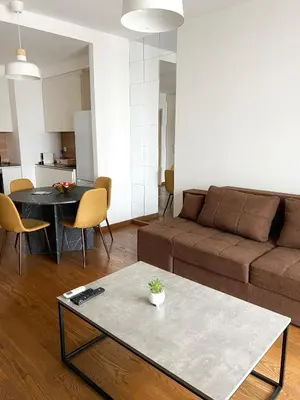a living room with a couch and a table at BW Maca - Arcadia in Belgrade
