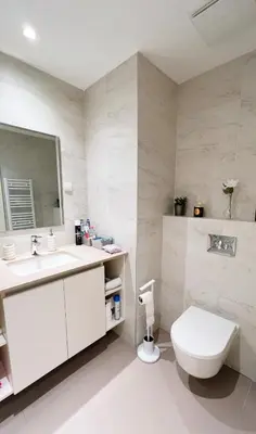 a bathroom with a toilet and a sink and a mirror at BW Maca - Arcadia in Belgrade