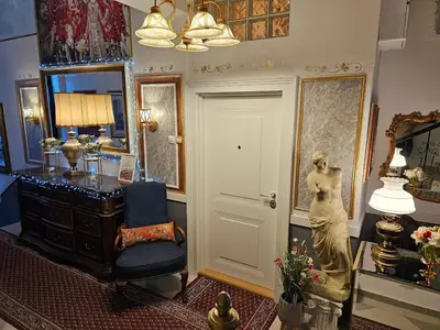 a room with a woman statue and a mirror at Belgrade Luxury Suite 23 in Belgrade