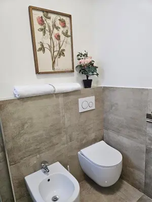 a bathroom with a toilet and a sink at Belgrade Luxury Suite 23 in Belgrade