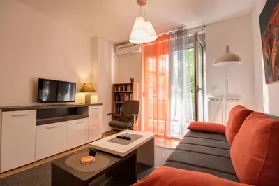 a living room with a couch and a table at Sekula's City Center Apartment in Belgrade
