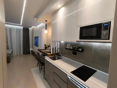 a kitchen with a sink and a microwave above a counter at Gallery-mall Studio Belgrade Waterfont in Belgrade
