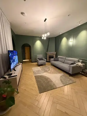 a living room with a couch and a tv at MiVa Apartment in Belgrade