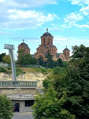 a large building with two domes on top of a hill at MiVa Apartment in Belgrade
