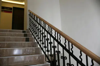 a set of stairs with a metal railing at Theater Hotel Belgrade in Belgrade