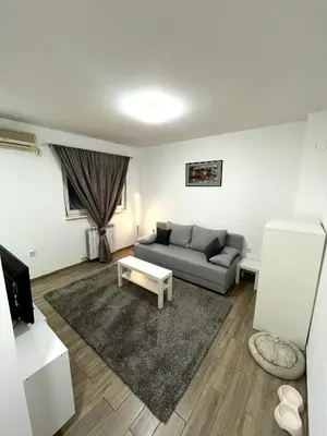 a living room with a couch and a table at A&D apartment in Belgrade