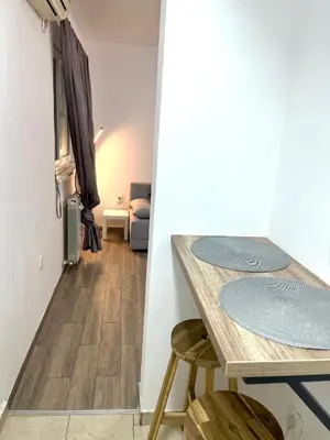a dining room with a table and two chairs at A&D apartment in Belgrade