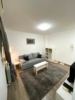 a living room with a couch and a table at A&D apartment in Belgrade