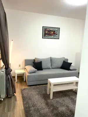 a living room with a couch and a table at A&D apartment in Belgrade