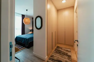 a bedroom with a bed and a mirror at BW City Elegance Collection in Belgrade