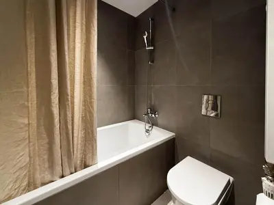 a bathroom with a tub and a toilet and a shower at BW City Elegance Collection in Belgrade