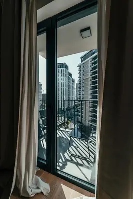 a window with a view of a city skyline at BW Symphony Suites in Belgrade