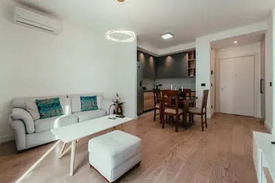 a living room with a couch and a table at BW Symphony Suites in Belgrade