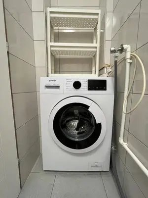 a washer and dryer in a small room at Miran Stan u Srcu Grada in Belgrade