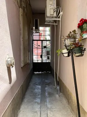 an empty hallway of a building with a door and plants at Miran Stan u Srcu Grada in Belgrade
