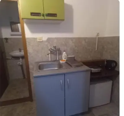 a small kitchen with a sink and a sink at Julijana in Belgrade