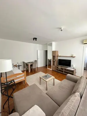 a living room with a couch and a table at Urban Nest 36A in Belgrade
