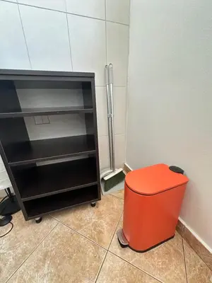 an orange stool sitting next to a refrigerator at Urban Nest 36A in Belgrade