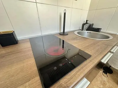 a kitchen counter with a sink and a microwave at Urban Nest 36A in Belgrade