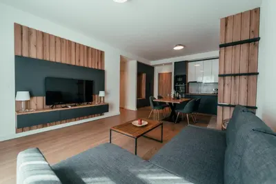 a living room with a couch and a table at BW Dolce Residenza in Belgrade