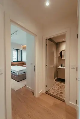 a bedroom with a bed and a mirror at BW Dolce Residenza in Belgrade