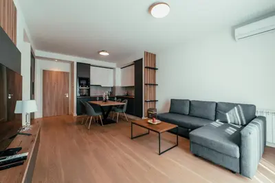 a living room with a couch and a table at BW Dolce Residenza in Belgrade