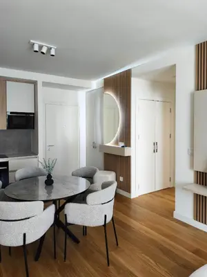a dining room with a table and chairs at BW Crown Garden Residences in Belgrade