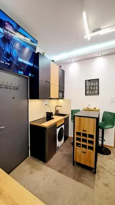 a kitchen with a sink and a counter in a room at Tailor Palace in Belgrade