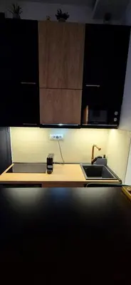 a kitchen counter top with a sink and a sink at Tailor Palace in Belgrade