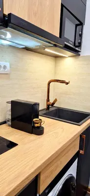 a kitchen counter with a sink and a microwave at Tailor Palace in Belgrade