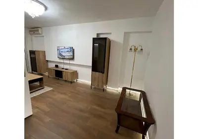 a room with a table and a television in a room at Apartman 18 in Belgrade