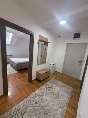a bedroom with a mirror and a bed in it at Port 5 in Kalugjerica