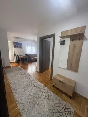 a living room with a mirror and a table at Port 5 in Kalugjerica