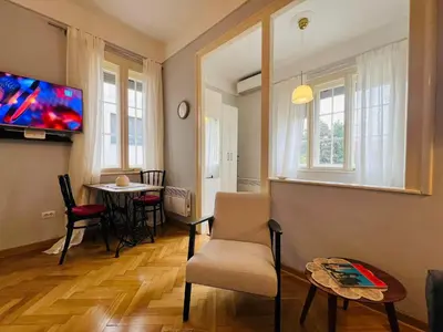a living room with a chair and a table at Belgrade ST6 in Belgrade