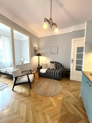 a living room with a couch and a table at Belgrade ST6 in Belgrade