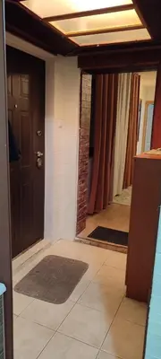 a hallway with a door and a room with a mirror at Spacious House with Terrace - Vozdovac in Belgrade