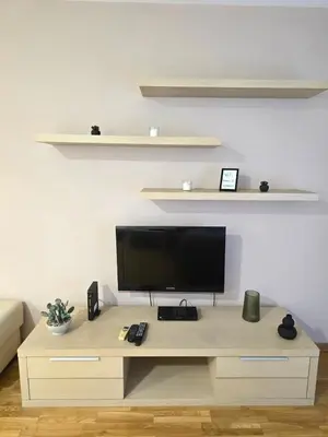 a desk with a television on it in a living room at Slavia center apartment in Belgrade