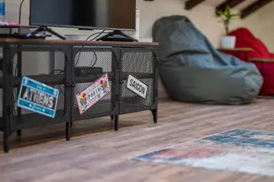 a black table with signs on it in a living room at The Belfort Townhomes - Green Lux Loft in Belgrade