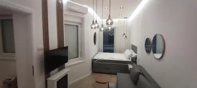 a small room with a bed and a window at Apartment Hilandarska 2 in Belgrade
