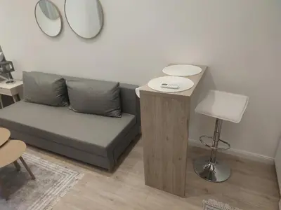 a living room with a couch and a table at Apartment Hilandarska 2 in Belgrade
