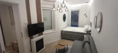 a small living room with a tv and a couch at Apartment Hilandarska 2 in Belgrade