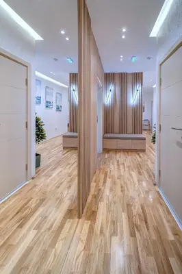 an office lobby with wood paneled walls and wooden floors at Jacuzzi Spa King Apartments FREE PARKING in Belgrade