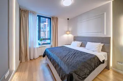 a bedroom with a bed and a window at Belgrade Waterfront Ana Premium Living in Belgrade