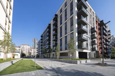 an apartment building with balconies on a street at Belgrade Waterfront Ana Premium Living in Belgrade